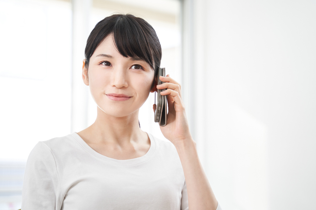 Japanese women making calls on their smart phones